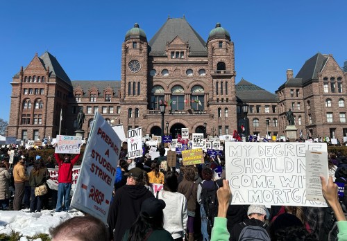 People take part in a rally over OSAP cuts outside Queen's Park in Toronto on Wednesday March 4, 2026. THE CANADIAN PRESS/Allison Jones