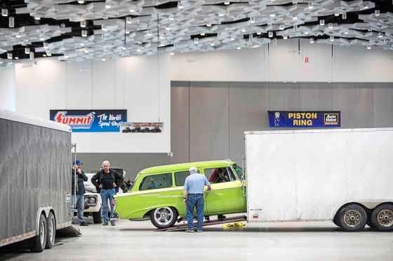 Jamie Phillips and Ken Miller move Miller's 1957 Studebaker into the RBC Convention Centre on Wednesday, ahead of the 49th annual World of Wheels car show this weekend. (Mikaela MacKenzie / Free Press)