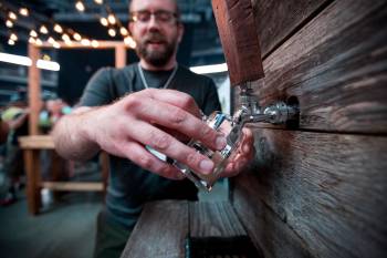JUSTIN SAMANSKI-LANGILLE / WINNIPEG FREE PRESS Brian Westcott of Barn Hammer Brewing Company pours a sample Saturday at the Flatlander&rsquo;s Beer Festival at the MTS Centre. 170610 - Saturday, June 10, 2017.