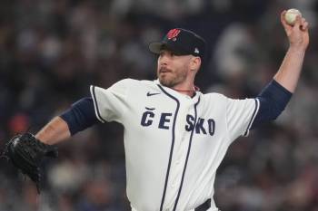 Czech Republic&rsquo;s Ryan Johnson pitches against Australia in the eighth inning of a World Baseball Classic game in Tokyo, Friday, March 6, 2026. (Hiro Komae / The Associated Press)