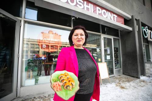 MIKAELA MACKENZIE / FREE PRESS
                                Sushi Point owner Olha Vovkotrub outside her restaurant at 238 Portage Ave. The eatery is listed on a new community project that features 138 local businesses, all operated by Ukrainians.