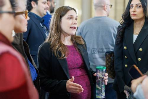 MIKE DEAL / FREE PRESS
                                Cindy Lamoureux, Liberal MLA for Tyndall Park, and supporters of The Autism Strategy Act, meet in the Rotunda at the Manitoba Legislative Building Tuesday morning.