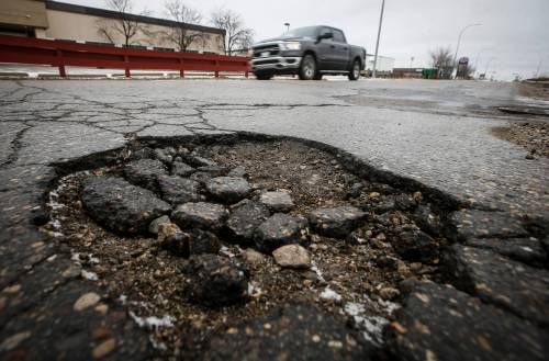 JOHN WOODS / FREE PRESS FILES
                                A survey of 649 CAA Manitoba members found they spent an average of $944 to repair pothole damage to their vehicles last year, up from $882 the year before.