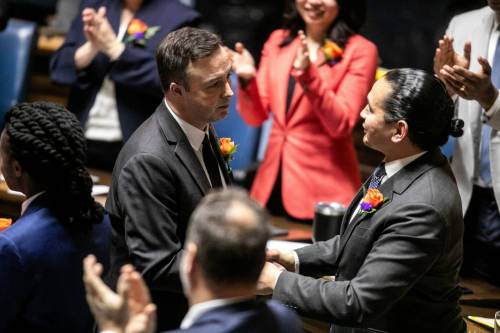 MIKAELA MACKENZIE / FREE PRESS
                                Finance minister Adrien Sala shakes hands and congratulates colleagues before tabling the budget in the legislative chamber on Tuesday, March 24, 2026.