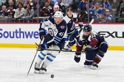 David Zalubowski / The Associated Press
                                Winnipeg Jets left wing Cole Koepke (45) drives past Colorado Avalanche defenceman Brent Burns, right, to score in the second period of an NHL hockey game Saturday, March 28, 2026, in Denver. Increased secondary scoring by Koepke and others is part of the reason the Jets are still in the playoff race.