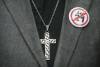A button denouncing Bill 21 is shown on a lapel next to a crucifix during a demonstration against the bill in Montreal, Sunday, October 6, 2019.The controversial Quebec secularism law bans some public-sector employees from wearing religious symbols in the workplace. (Graham Hughes / The Canadian Press files)
