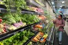 FILE - A person shops at a grocery store in Schaumburg, Ill., Monday, Feb. 9, 2026. (AP Photo/Nam Y. Huh, File)