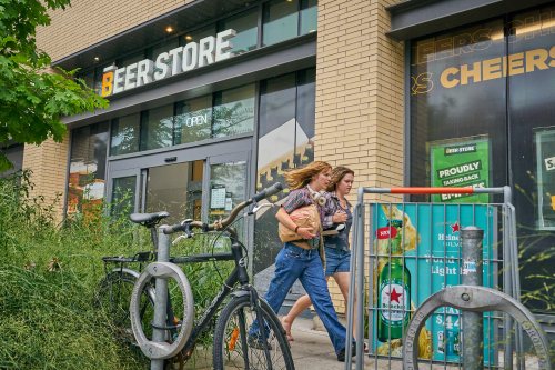 Pedestrians pass a Beer Store on Gerrard Street in Toronto’s east end that is scheduled to close this fall, on Tuesday, August 19, 2025. THE CANADIAN PRESS/Sammy Kogan