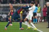 Genoa's Caleb Ekuban, left, argues with Roma's Devyne Rensch during the Italian Serie A soccer match between Genoa and Roma in Genoa, Italy, Sunday, March 8, 2026. (Tano Pecoraro/LaPresse via AP)