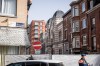 Police stand near a fence as they secure an area after a blast near a synagogue in Liege, Belgium, Monday, March 9, 2026. (AP Photo/Valentin Bianchi)