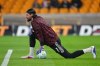 Liverpool's goalkeeper Alisson warms-up before the English Premier League soccer match between Wolverhampton Wanderers and Liverpool in Wolverhampton, England, Tuesday, March 3, 2026. (AP Photo/Dave Shopland)