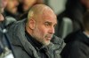 Manchester City's head coach Pep Guardiola sits on the bech during the fifth round FA Cup soccer match between Newcastle and Manchester City in Newcastle, England, Saturday, March 7, 2026. (AP Photo/Ian Hodgson)