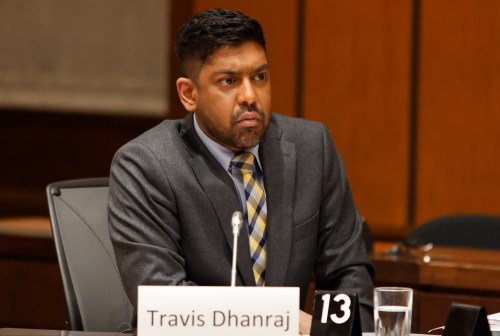Former CBC journalist Travis Dhanraj waits to appear before the Standing Committee on Canadian Heritage (CHPC) in Ottawa on Tuesday, March 10, 2026. THE CANADIAN PRESS/ Patrick Doyle