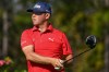 FILE - Gary Woodland looks on after hitting his tee shot on the second hole during the final round of the PNC Championship golf tournament, Dec. 21, 2025, in Orlando, Fla. (AP Photo/Phelan M. Ebenhack, File)