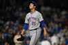 FILE - New York Mets starting pitcher Jonah Tong leaves the game during the third inning of a baseball game against the Chicago Cubs, Sept. 24, 2025, in Chicago. (AP Photo/Paul Beaty, File)