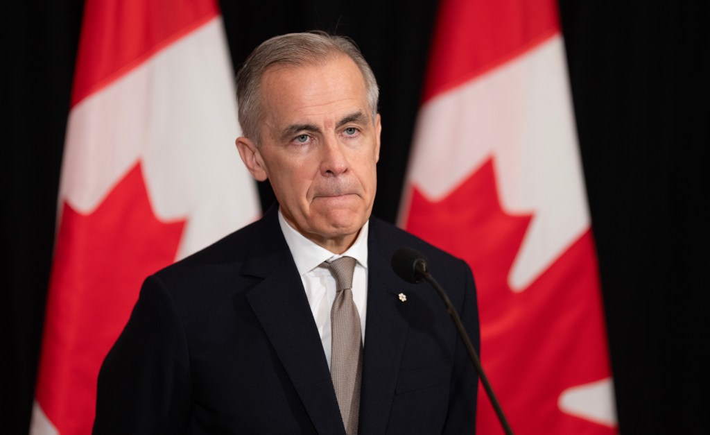 Prime Minister Mark Carney speaks with reporters in Sydney, Australia, on Wednesday, March 4, 2026. THE CANADIAN PRESS/Adrian Wyld