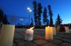 Candles sit on the ground as people attend a vigil for the victims of a mass shooting in Tumbler Ridge, B.C., on Friday, Feb. 13, 2026. THE CANADIAN PRESS/Christinne Muschi