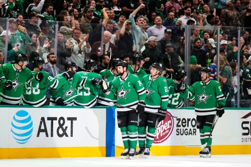 Dallas Stars' Jamie Benn (14), Jason Robertson (21) and Wyatt Johnston (53) celebrate with the team after Benn scored in the second period of an NHL hockey game against the Vegas Golden Knights in Dallas, Tuesday, March 10, 2026. (AP Photo/Tony Gutierrez)