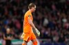 Tottenham's goalkeeper Antonin Kinsky leaves the pitch after being substituted during the first leg of the Champions League round of 16 soccer match between Atletico Madrid and Tottenham in Madrid, Spain, Tuesday, March 10, 2026. (AP Photo/Jose Breton)