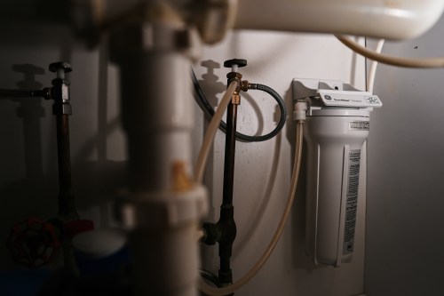 An under sink water filter operates Monday, March 9, 2026, in Cincinnati. (AP Photo/Joshua A. Bickel)