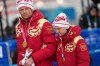 Anastasiia Bagiian, of Russia, leaves the podium with her guide Sergei Siniakin, after winning the gold medal in the cross country skiing women's 10Km interval start classic vision impaired final at the 2026 Winter Paralympics, in Tesero, Italy, Wednesday, March 11, 2026. (AP Photo/Evgeniy Maloletka)