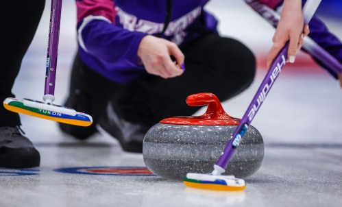 A rock crosses the hog line during a game at the Scotties Tournament of Hearts in Calgary on Feb. 19, 2024. THE CANADIAN PRESS/Jeff McIntosh