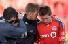 Toronto FC's  acting head coach Chris Cummins (left) and team captain Jim Brennan (right) leave the pitch  after their 1-0 win over Kansas City Wizards in MLS action in Toronto on Sunday, April 26, 2009. Cummins took temporary charge of the side after former head coach John Carver resigned Saturday. THE CANADIAN PRESS/Chris Young