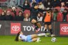 Vancouver Rise FC forward Holly Ward (19) jumps over a slide tackle by AFC Toronto midfielder Victoria Pickett (94) during second half NSL final action in Toronto, on Saturday, Nov. 15, 2025. THE CANADIAN PRESS/Sammy Kogan
