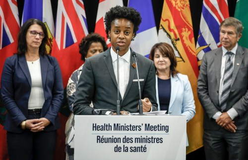 Manitoba Minister of Health Uzoma Asagwara, centre, addresses the media at a wrap-up news conference following a health ministers meeting in Calgary, Friday, Oct. 17, 2025. THE CANADIAN PRESS/Jeff McIntosh