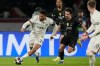 Chelsea's Reece James, left, and PSG's Vitinha challenge for the ball during the first leg of the Champions League round of 16 soccer match between Paris Saint-Germain and Chelsea, in Paris, Wednesday, March 11, 2026. (AP Photo/Michel Euler)