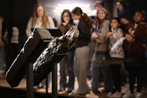 School children visit the National Museum of African American History and Culture's Middle Passage exhibit, behind a wooden timber, the artifact at right, from the slave ship, the São José-Paquete de Africa, Friday, March 6, 2026, in Washington. (AP Photo/Jacquelyn Martin)