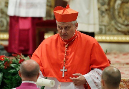 FILE - Cardinal Konrad Krajewski walks after being elected in a consistory in St. Peter's Basilica at the Vatican, Thursday, June 28, 2018. (AP Photo/Alessandra Tarantino, File)