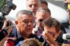 Claudio Tapia, top center, president of the Argentine Soccer Association (AFA) arrives to court in connection with a complaint filed by Argentina's tax collection agency on failure to pay social security taxes in Buenos Aires, Argentina, Thursday, March 12, 2026. (AP Photo/Natacha Pisarenko)
