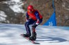 Mike Schultz of the US competes in the Para Snowboard Men's Snowboard Cross SB-LL1 Quarterfinal 2 competition at the 2026 Winter Paralympics, in Cortina d'Ampezzo, Italy, Sunday March 8, 2026. (Jed Jacobsohn/OIS/IOC via AP)
