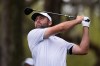 Scottie Scheffler hits his tee shot on the 12th hole during the first round of The Players Championship golf tournament Thursday, March 12, 2026, in Ponte Bedra Beach, Fla. (AP Photo/Gerald Herbert)