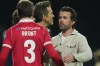 Actors and Wrexham owners Ryan Reynolds, center, and Rob McElhenney stand on the pitch after the fifth round FA Cup soccer match between Wrexham and Chelsea in Wrexham, Wales, Saturday, March 7, 2026. (AP Photo/Jon Super)