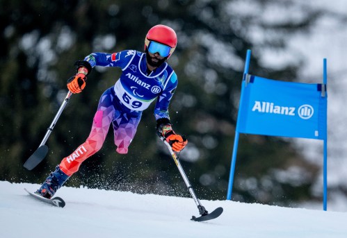 Haiti's Ralf Etienne competes during the Para Alpine Skiing Men's Giant Slalom Standing Run 1 competition at the 2026 Winter Paralympics, in Cortina, Italy, Friday March 13, 2026. (Remi Vallat/OIS/IOC via AP)