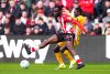 Sunderland's Lutsharel Geertruida, left, and Brighton and Hove Albion's Yankuba Minteh fight for the ball during the Premier League match in Sunderland, England, Saturday March 14, 2026. (Owen Humphreys/PA via AP)