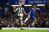Newcastle United's Joelinton, left, and Chelsea's Enzo Fernandez battle for the ball during the Premier League match between Chelsea and Newcastle, in London, Saturday March 14, 2026. (John Walton/PA via AP)