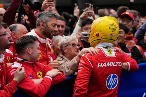 Ferrari driver Lewis Hamilton of Britain celebrates after he clocked the third fastest time in the Chinese Formula One Grand Prix race at the Shanghai International Circuit, in Shanghai, China, Sunday, March 15, 2026. (AP Photo/Andy Wong)