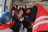 Paramedics give first aid to an injured resident following Russian aerial guided bomb strike in Zaporizhzhia, Ukraine, Saturday, March 14, 2026. (AP Photo/Kateryna Klochko)