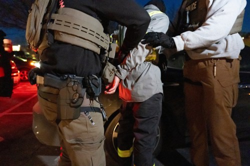 FILE - U.S. Immigration and Customs Enforcement officers detain a person, Jan. 27, 2025, in Silver Spring, Md. (AP Photo/Alex Brandon, File)