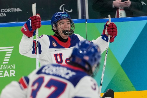 United States's Jack Wallace celebrates after scoring his side's first goal during a gold medal ice hockey match between United States and Canada at the 2026 Winter Paralympics, in Milan, Italy, Sunday, March 15, 2026. (AP Photo/Luca Bruno)