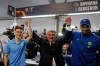 Joan Laporta, center, reacts as he poses with players Gavi, left, and Ronald Araujo after the voting for the election to be president of FC Barcelona in Barcelona, Spain, Sunday, March 15, 2026. (AP Photo/Joan Monfort)
