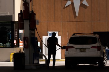 FILE - A person gets gas at a station March 10, 2026, in New York. (AP Photo/Yuki Iwamura, File)