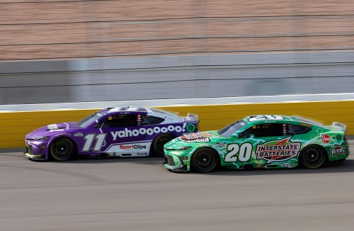 Denny Hamlin (11) drives ahead of Christopher Bell (20) during a NASCAR Cup Series auto race Sunday, March 15, 2026, in Las Vegas. (AP Photo/Steve Marcus)