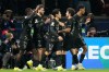 PSG's Khvicha Kvaratskhelia celebrates with teammates after scoring his side's fifth goal during the first leg of the Champions League round of 16 soccer match between Paris Saint-Germain and Chelsea, in Paris, Wednesday, March 11, 2026. (AP Photo/Michel Euler)