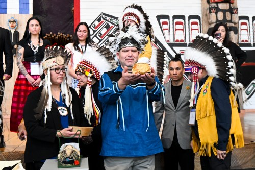 Grand Chief Leonard Lazore holds a birch sap collector following its repatriation from the Vatican collection during an unveiling event at the Canadian Museum of History in Gatineau, Que., on Tuesday, March 10, 2026. THE CANADIAN PRESS/Spencer Colby
