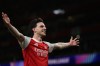Arsenal's Declan Rice celebrates after scoring his side's second goal during the second leg of the Champions League round of 16 soccer match between Arsenal and Bayer Leverkusen, in London, Tuesday, March 17, 2026. (AP Photo/Ian Walton)