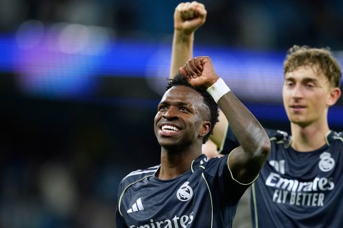 Real Madrid's Vinicius Junior celebrates after the Champions League round of 16 second leg soccer match between Manchester City and Real Madrid in Manchester, Tuesday, March 17, 2026. (AP Photo/Dave Thompson)